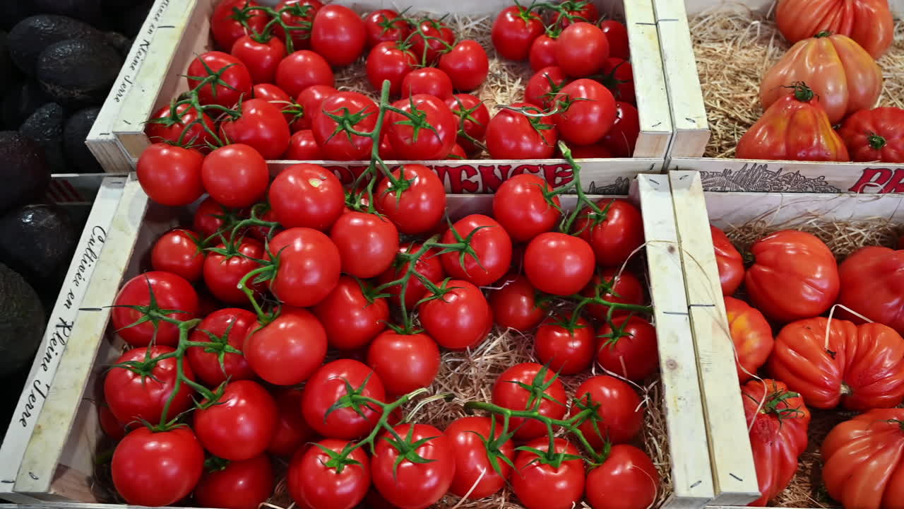 CANNES, FRANCE - AUGUST 28, 2021: Tomatoes counter at a market pavilion