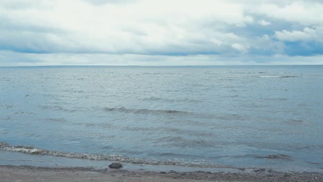 beach in saaremaa estonia, where waves are in slow motion and water ripples