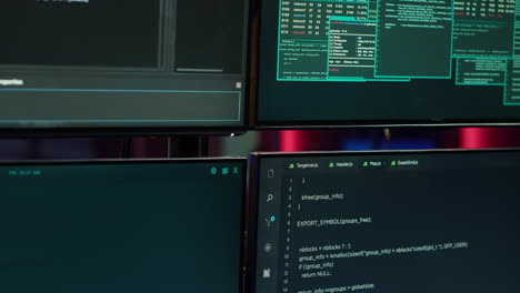 Hacking malware programming script on monitors in underground base