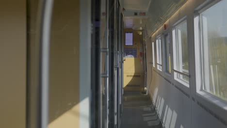 interior of a german ice high-speed train showing the corridor and seats