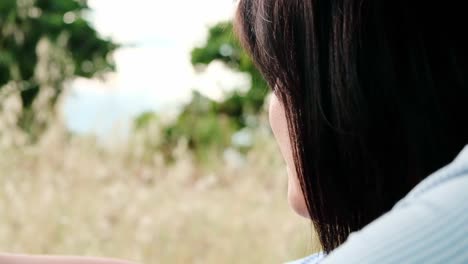 Young-woman-daydreaming-whilst-watching-the-countryside-from-the-car-window