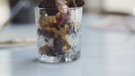 chocolate ice cream served in a cup, close up shot, tilt up shot, tilt down shot