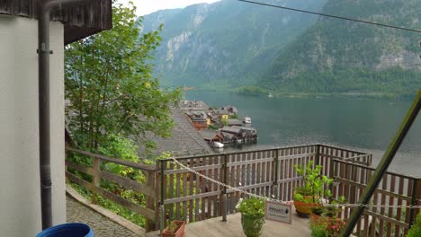 huge lake of hallstatt with mountains in background