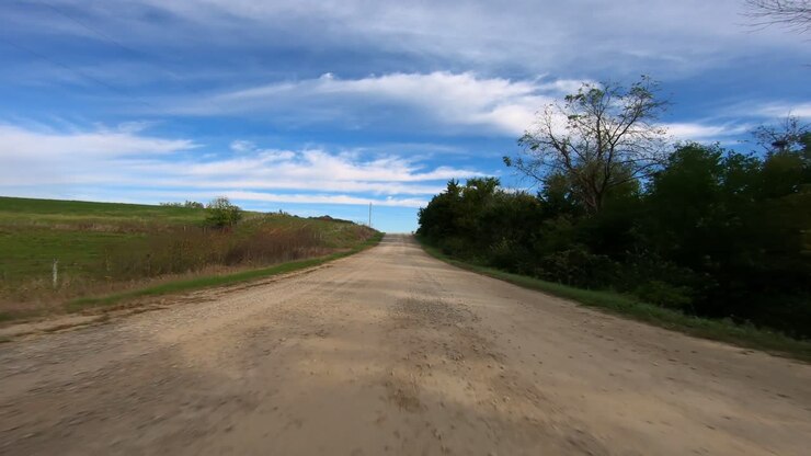 POV through driver's window while driving through rural Iowa