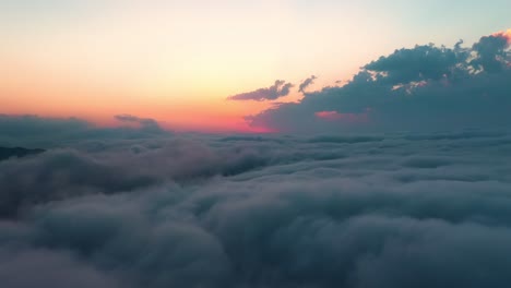 flying over the clouds with the late sun. sunrise or sunset colorful sky background.