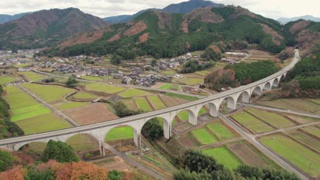 geometrical bridge around japanese countryside valley village green natural aerial drone landscape, takeda castle, asago hyogo japan