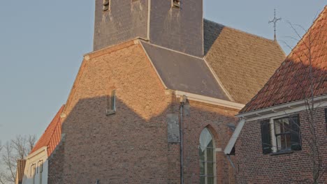 Close-Tilt-up-of-the-historical-Church-in-the-small-town-of-Bredevoort