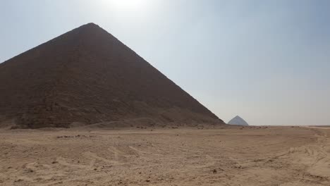 mesmerizing view of red or north pyramid at dahshur necropolis in cairo, egypt amidst dry arid land