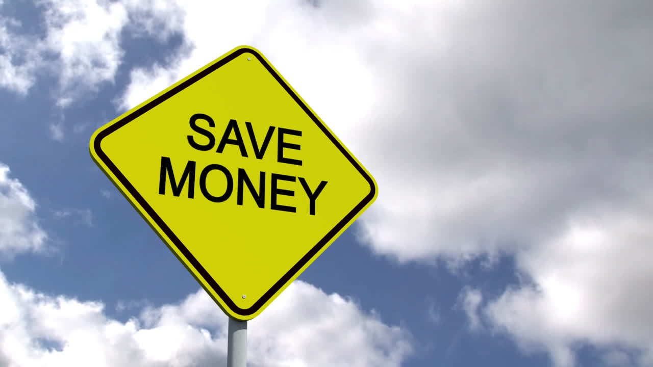Save money sign against blue sky 