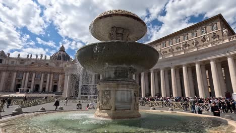 tourists gather around the iconic fountain