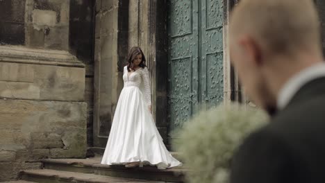 Newlyweds,-caucasian-groom-with-bride-walking,-embracing,-hugs-on-the-city-street,-wedding-couple