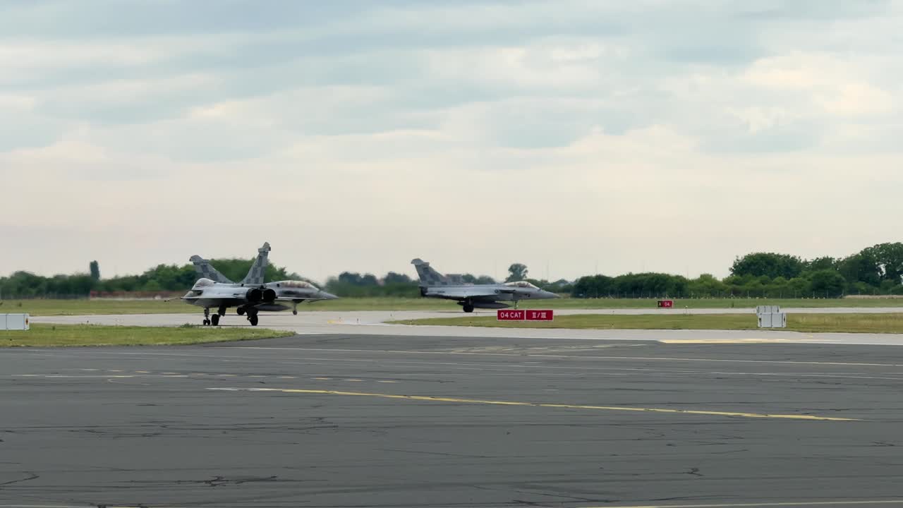 Three Military Rafale Jet Fighter Aircraft Taxiing Out to the Runway
