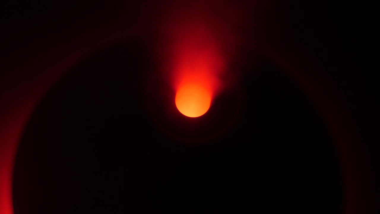 working a humidifier with a red circular light in the middle