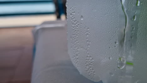 drops of water on a sweaty glass bottle