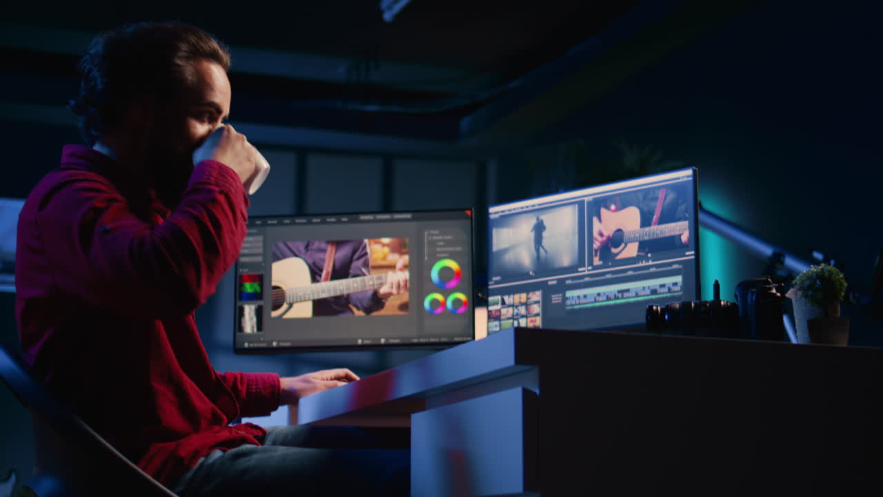 Post production studio employee starts shift in creative office, working with raw footage