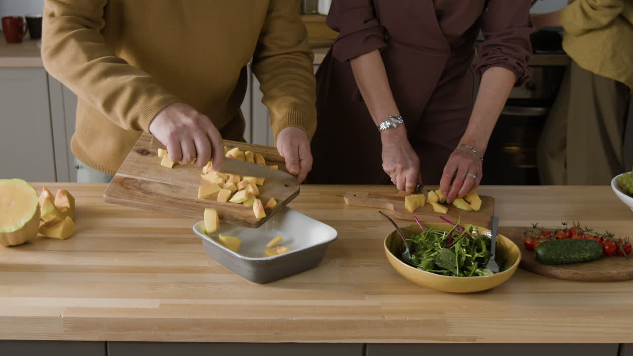 People Preparing Food in the Kitchen