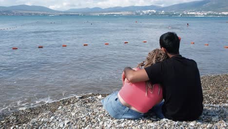 couple enjoying the beach and sea view