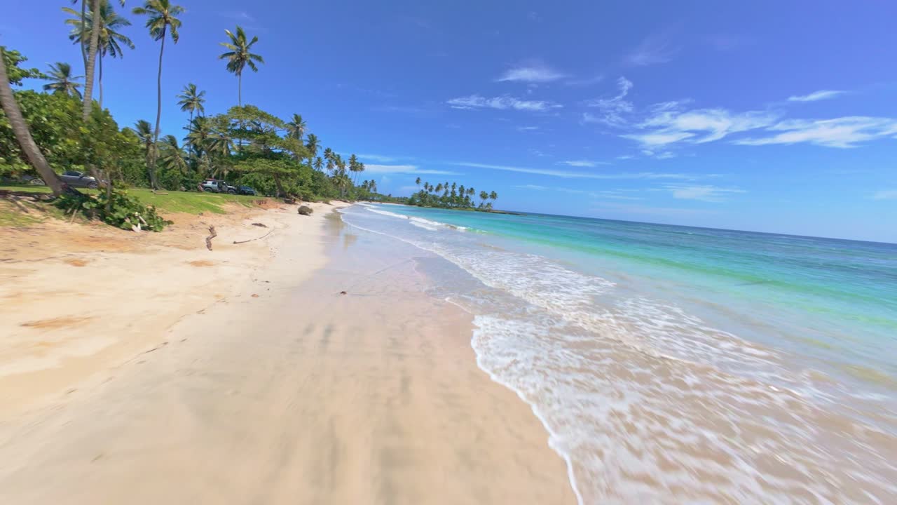 Paradise beach in Dominican Republic, FPV drone flying above it