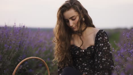 sensual woman on lavender field, putting on black tights