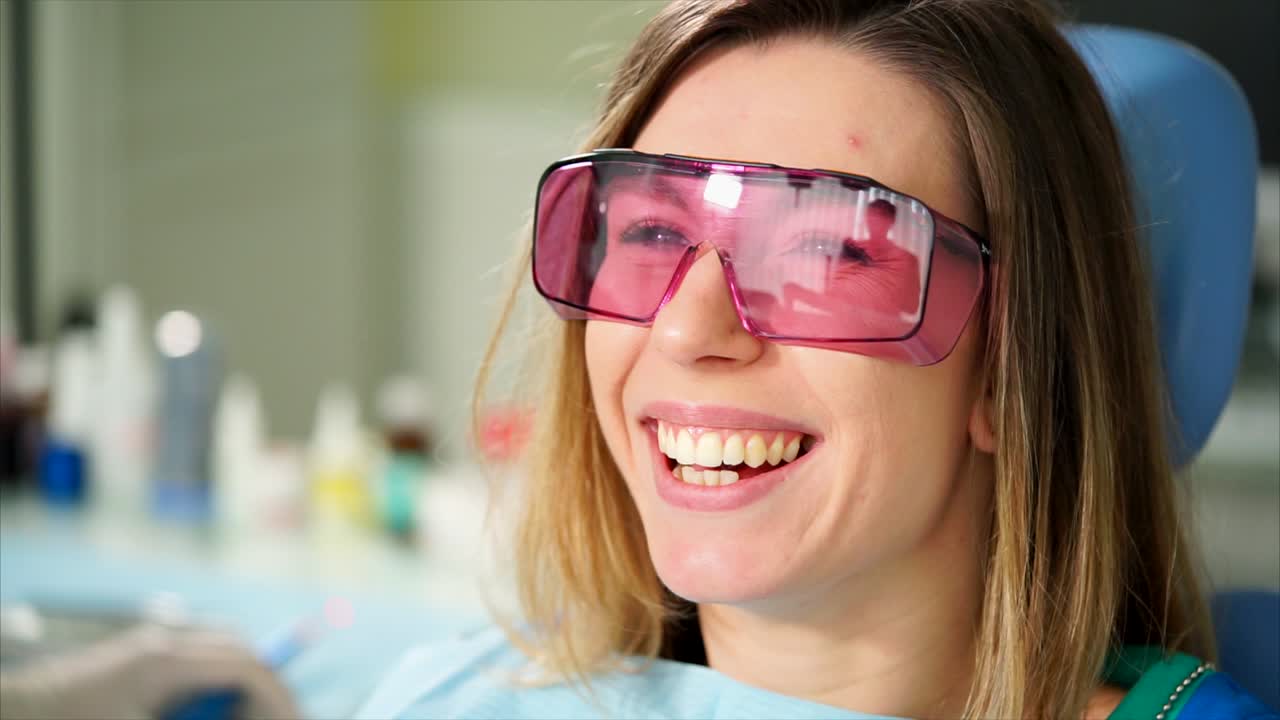 Woman at the dentist happily smiling