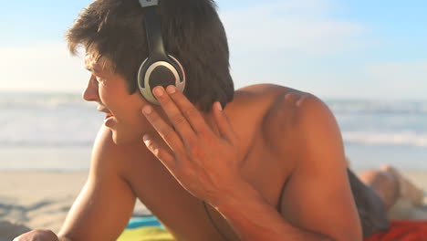 man listening to music with headphones