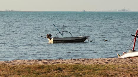 abandoned boat near shore in pattaya, thailand