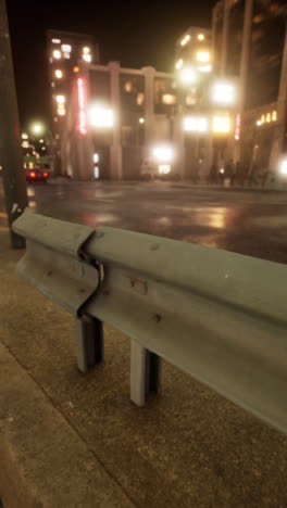 a wet city street at night