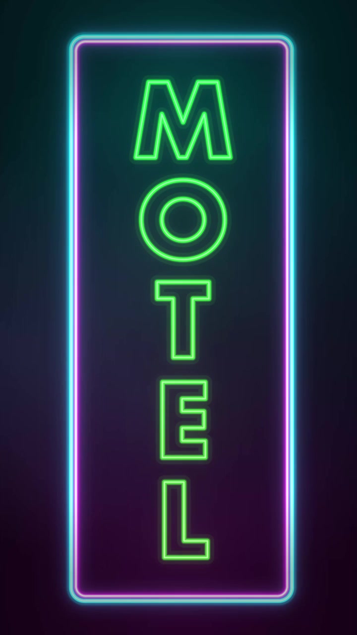 Enseigne de motel au néon clignotante la nuit