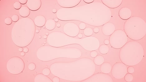 light pink different sized stretched bubbles take round shape