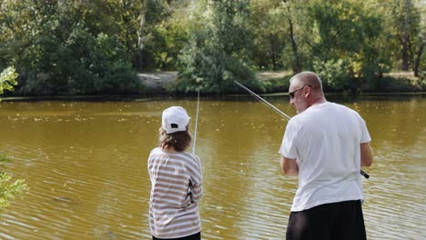 grandfather and granddaughter fishing