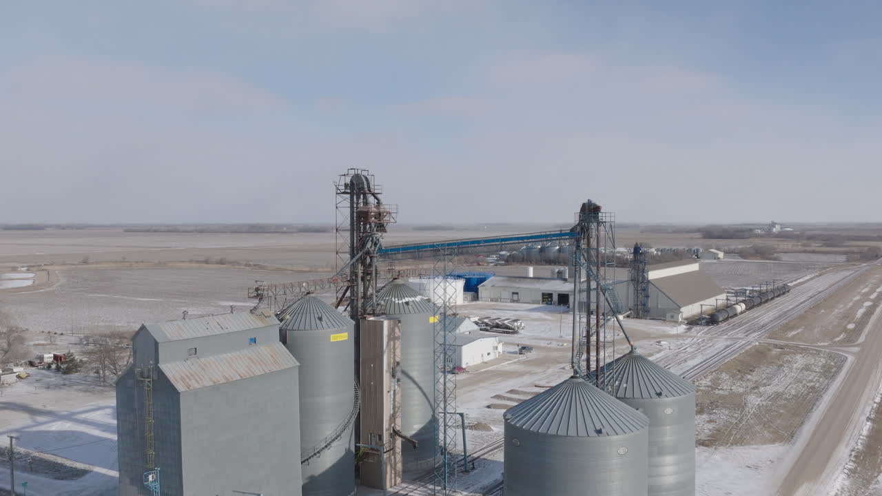 Aerial View of Fertilizer Plant Beside Snowy Farm Field