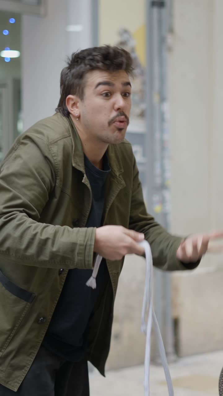 A man demonstrating a rope trick or street magic