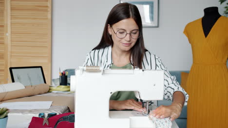 woman sewing a dress in a sewing studio