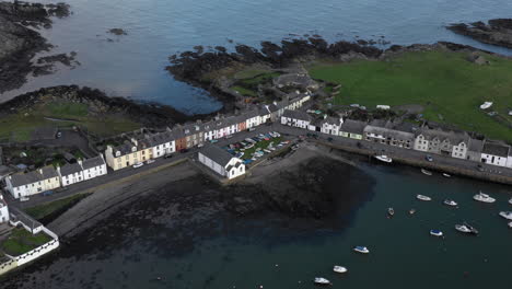 A-view-of-the-small-Scottish-village-of-Isle-of-Whithorn-in-Dumfries-and-Galloway-with-small-boats-anchored-in-the-harbour