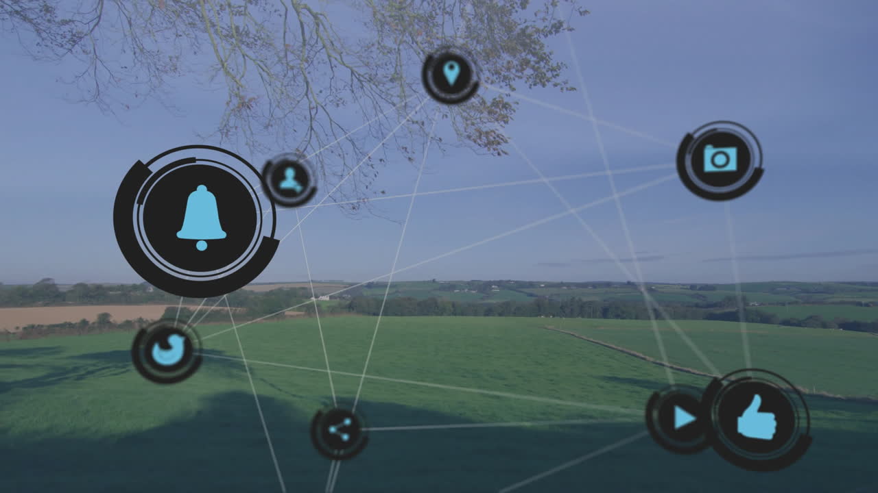 Animation of social media icons connecting over rural landscape in network