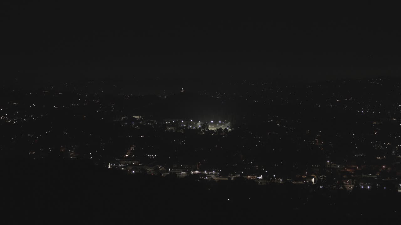 Fireworks surrounding a cityscape at night