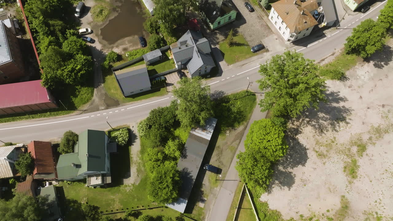 Aerial tilt shot the cityscape of Parnu city, sunny, summer day in Estonia