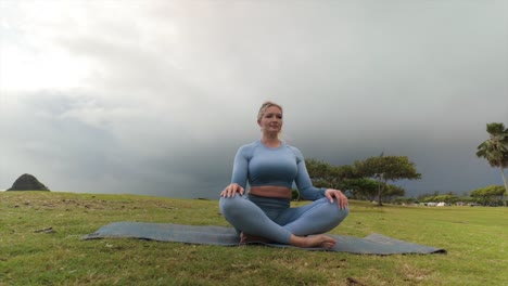 female meditation in fitness outfit