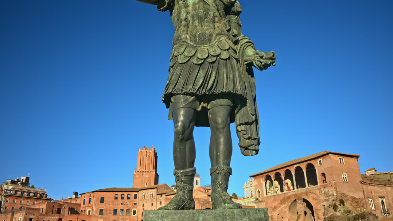 Julius Caesar bronze statue at sunset in Rome, Italy