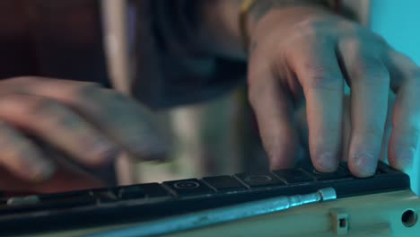 man hand putting cassette into old-fashioned audio tape player. close-up shot