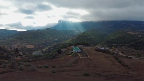 A-scenic-view-of-a-house-in-the-Montserrat-and-Marganell-Mountains-in-Barcelona