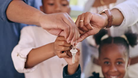 parents, children and hands with house keys of new