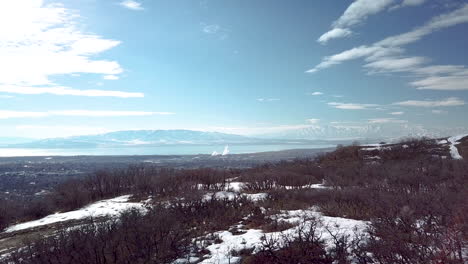 Looking-over-the-foothills-at-a-city-and-factory-in-the-valley-below