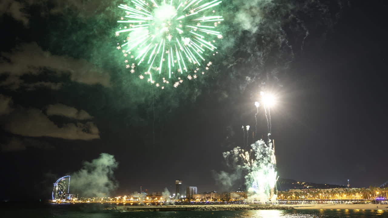Fireworks Display over a City Coastline at Night