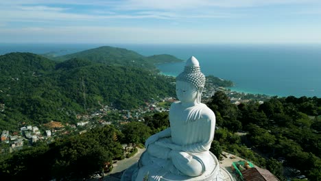 4K-Cinematic-nature-aerial-footage-of-a-drone-flying-over-the-Big-Buddha-on-top-of-the-mountains-in-Phuket,-Thailand-on-a-sunny-day