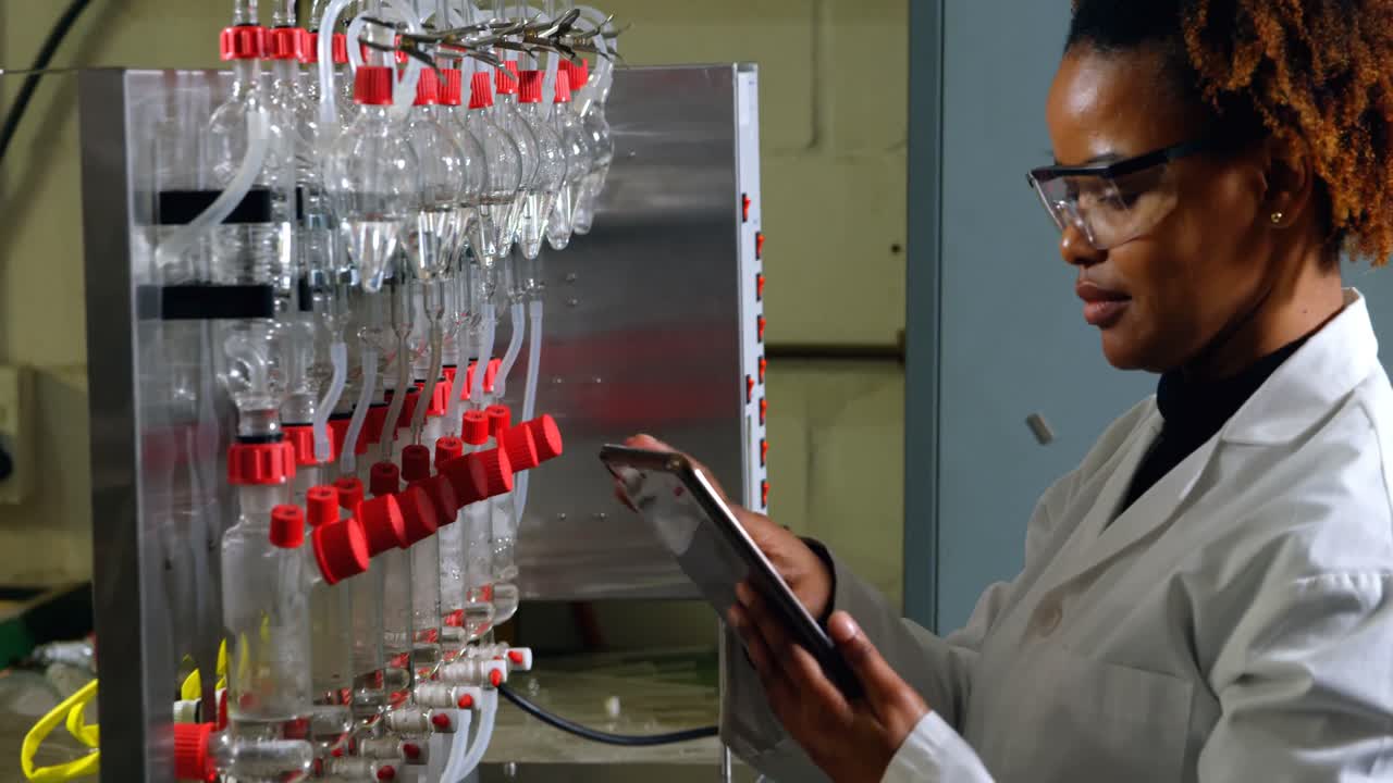 Female worker using digital tablet in glass factory 4k
