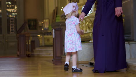 kid approaching to the priest