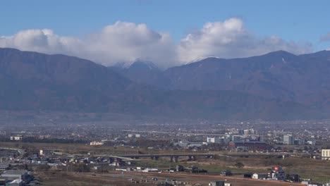 beautiful mountain and city view of yamashita prefecture - aerial wide shot