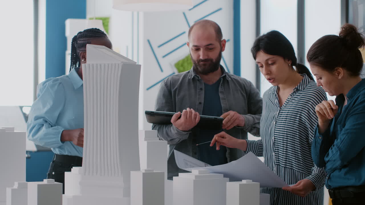 Architects Discussing Building Design with Model