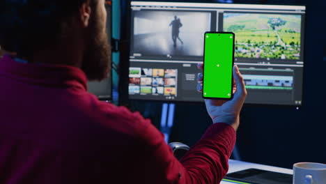 video editor following tutorial on green screen smartphone, learning to apply editing techniques